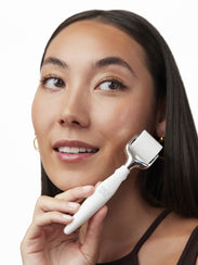 Brightening Active Roller for the skin model holding the product
