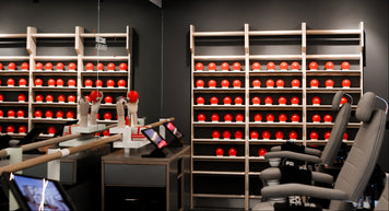 a room with shelves and red balls