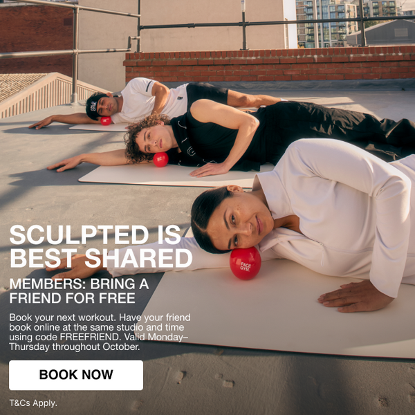 a group of people lying on a roof with red balls